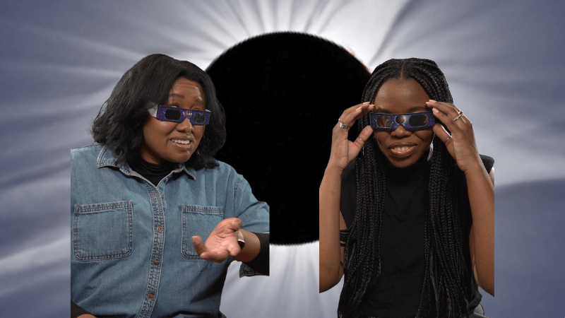 Titi and Zakiya with eclipse glasses in front of an image of an eclipse