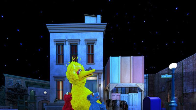 Big Bird, Elmo and other Sesame Street characters looking up at a starry sky.