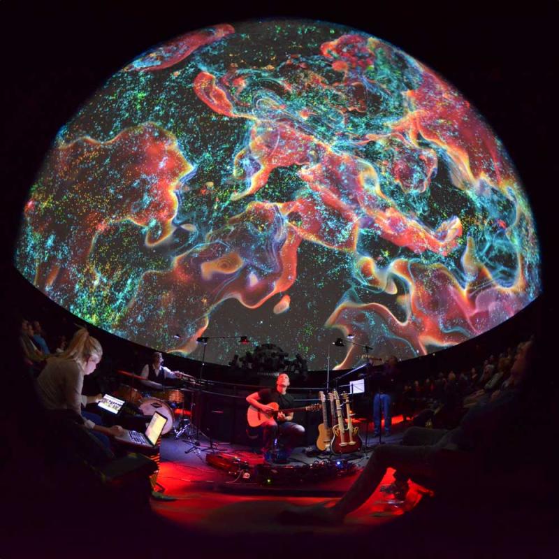 A visual music show taking place in the planetarium.