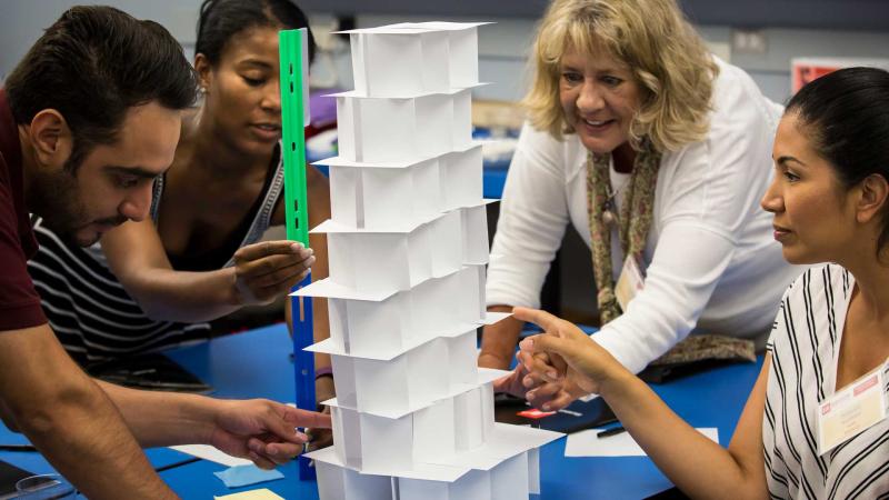 A group of educators doing an engineering project.