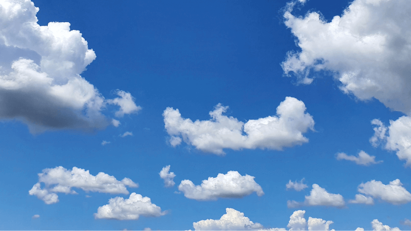 Puffy white clouds on a blue sky
