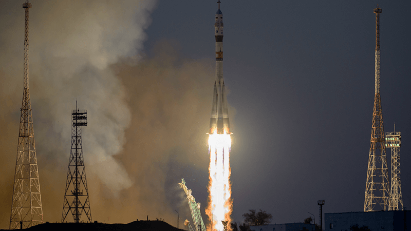A rocket takes off at night