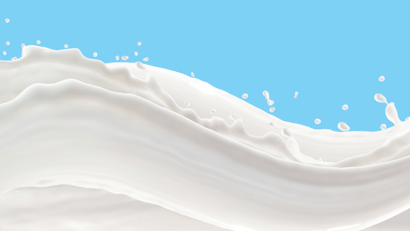 A white liquid splashes across a blue background