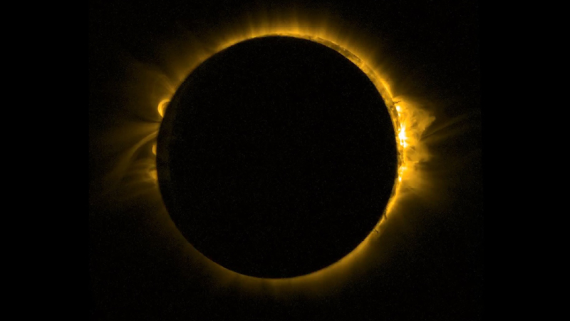 A total solar eclipse with a yellow corona