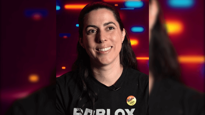 Genevieve Johnson in front of a colorful background