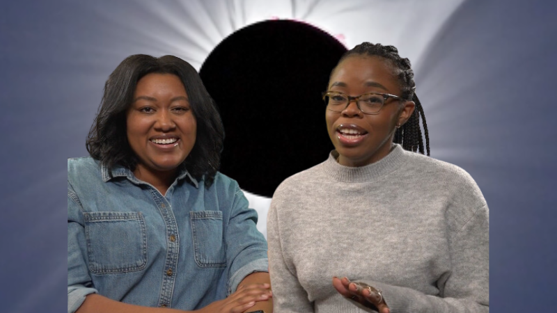 Titi and Zakiya in front of an eclipse