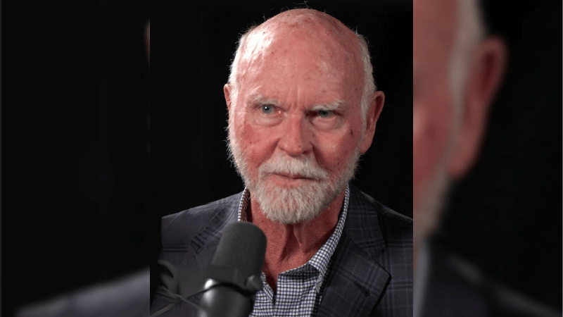 Craig Venter on a black background.