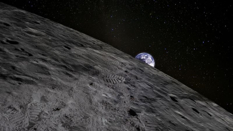 An illustration of the earth peaking out from behind the surface of the moon.