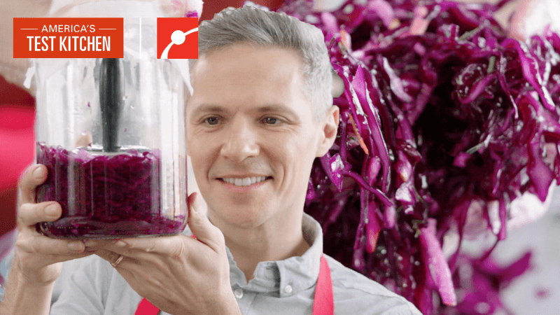 Joe Glitter from America's Test Kitchen with a jar of sauerkraut