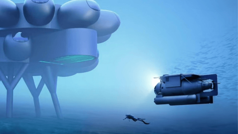 An artist's concept of the Proteus station with a diver and vehicle in the water around it.