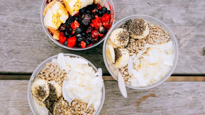 Three Acai bowls breakfast bowls.