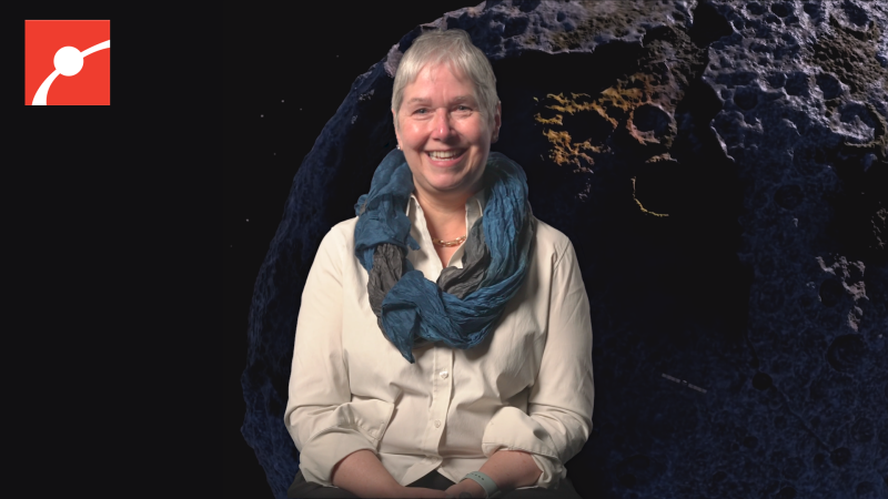 Lindy Elkins-Tanton smiling with asteroid behind her.