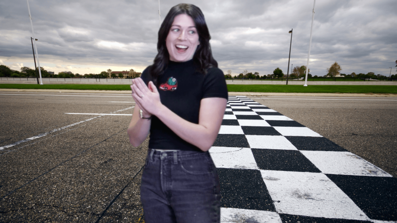 Sophie Shrand in front of a checkered finish line