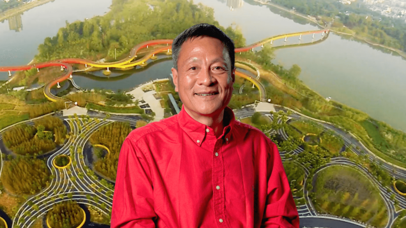 Professor Kongjian Yu in front of an image of a sponge city