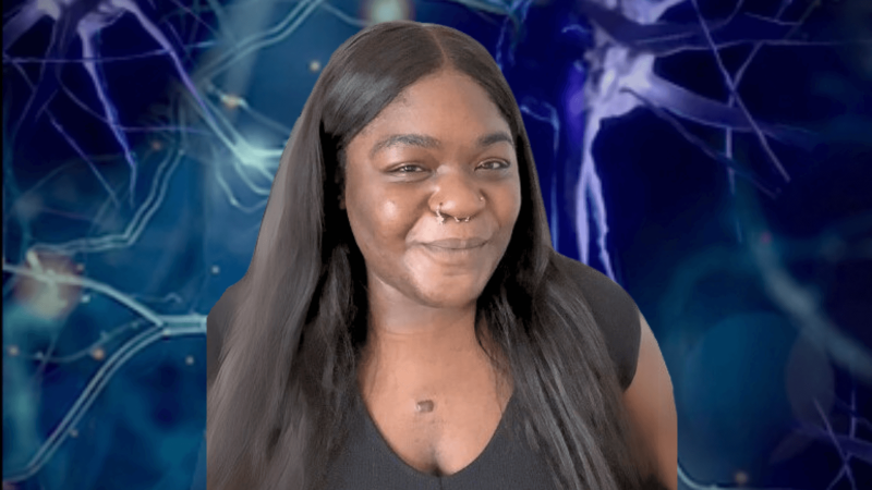 Lindsay Ejoh in front of an image of a neuron