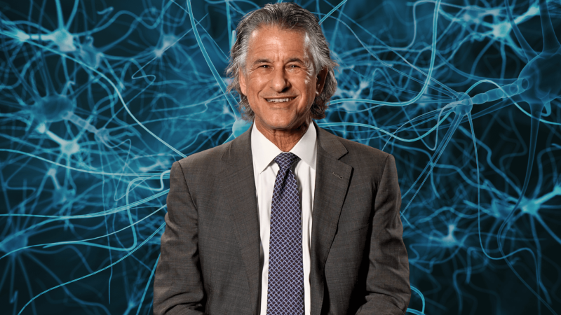Dr. Daniel Levitin with an image of neurons