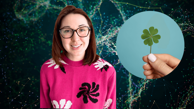 Alex Dainis in front of genes with a four leaf clover