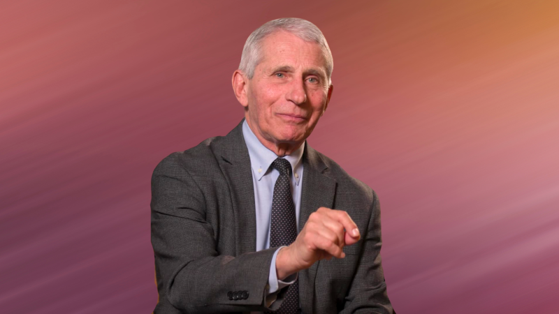 Dr. Fauci in front of an orange and pink background