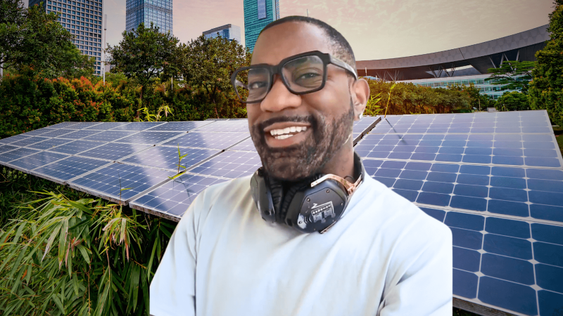 Maynard Okereke in front of solar panels