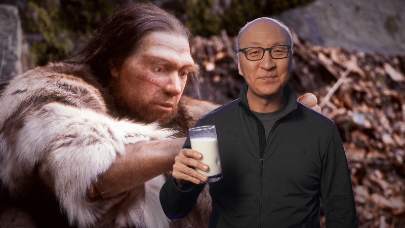 Insoo Hyun in front of a rendering of a Neanderthal