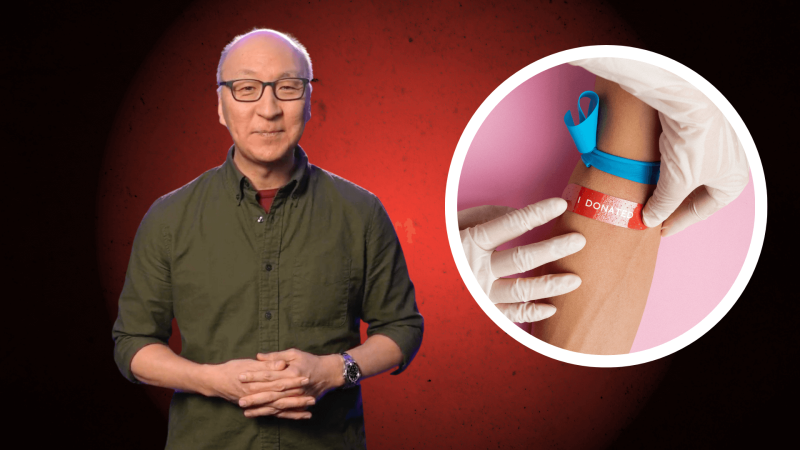 Insoo Hyun next to an arm after giving blood with a bandaid on it.