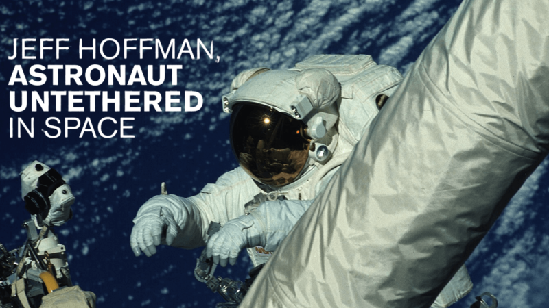 Dr. Jeff Hoffman on a space walk with Earth in the background