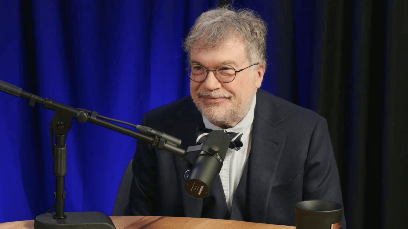 Peter Hotez in front of a dark blue background.