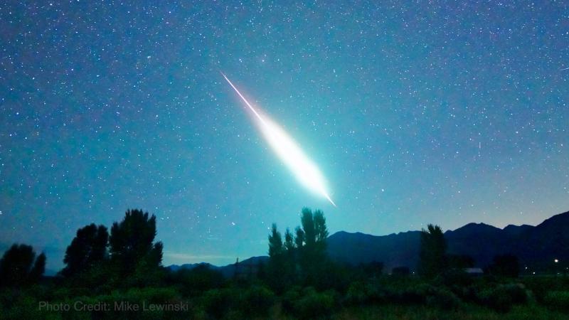 A meteor streaks across the sky