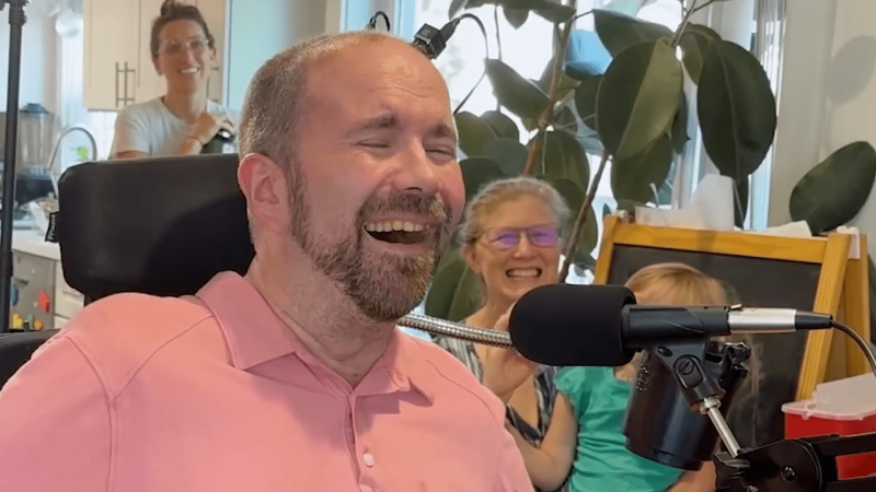 Casey Harrell smiling while using an AI brain-computer interface