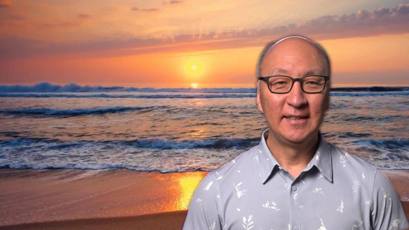 Insoo Hyun in front of the sun over the ocean