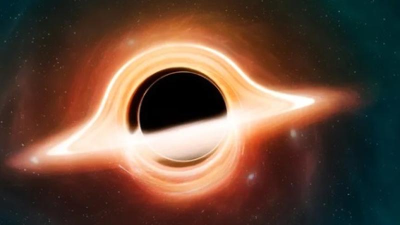 An artist’s illustration of what a black hole might look like viewed from up close. Credit: Mark Garlick/Science Photo Library/Getty Images