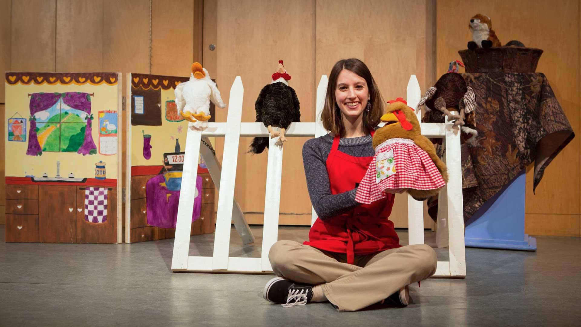 A museum eductaor preforming a puppet show during Live Animal Storytime.