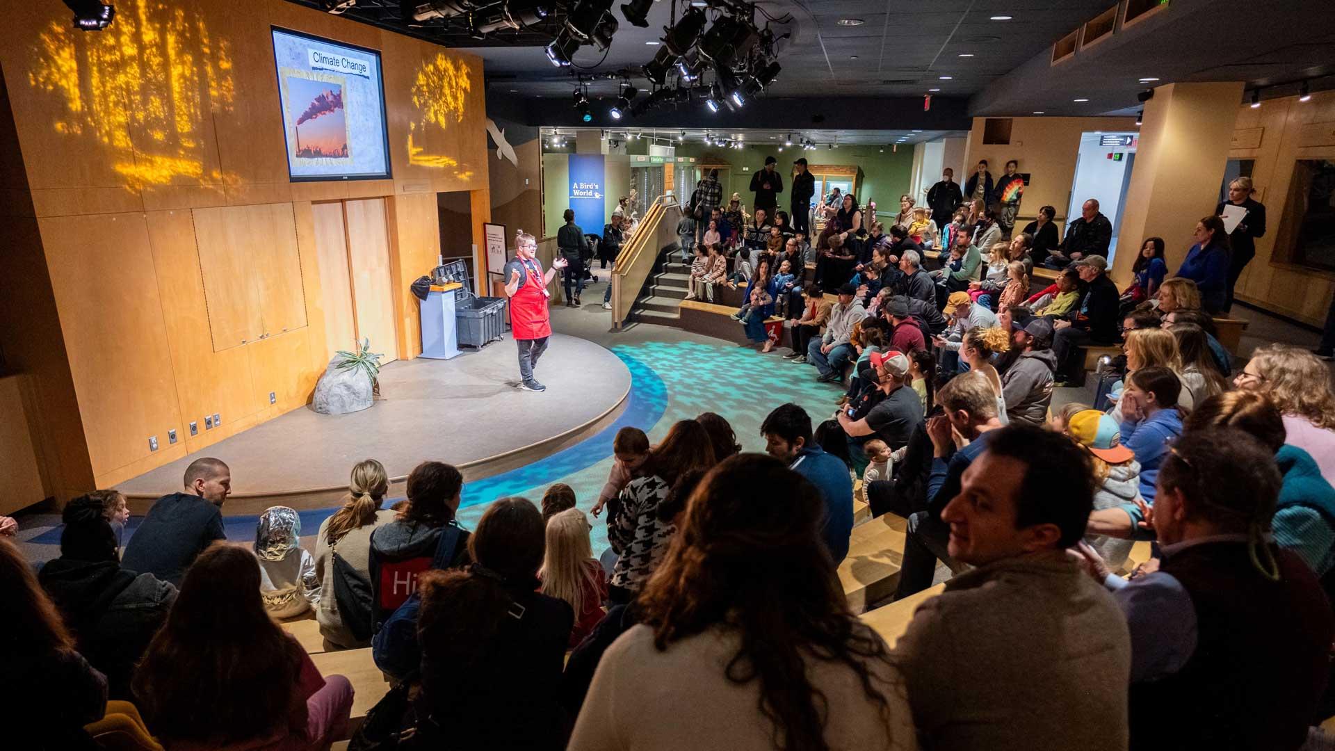 A museum eductaor on the Shapiro Science Live Stage in front of an Audience.