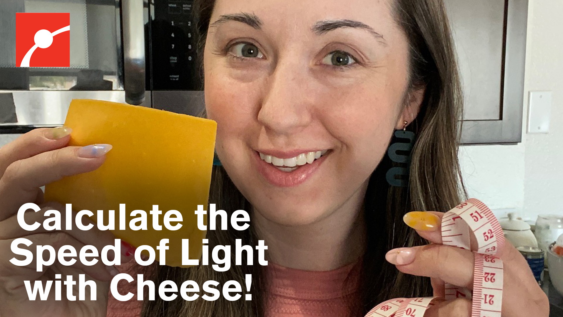 Alex Dainis holding up a piece of cheese and measure tape with the text Calculate the Speed of Light with Cheese 