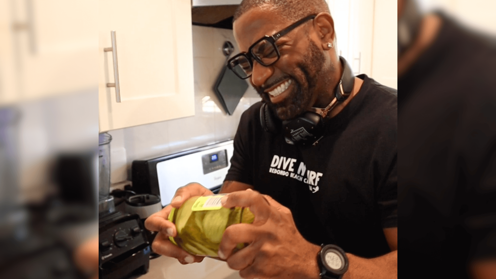 Maynard Okereke trying to open a pickle jar