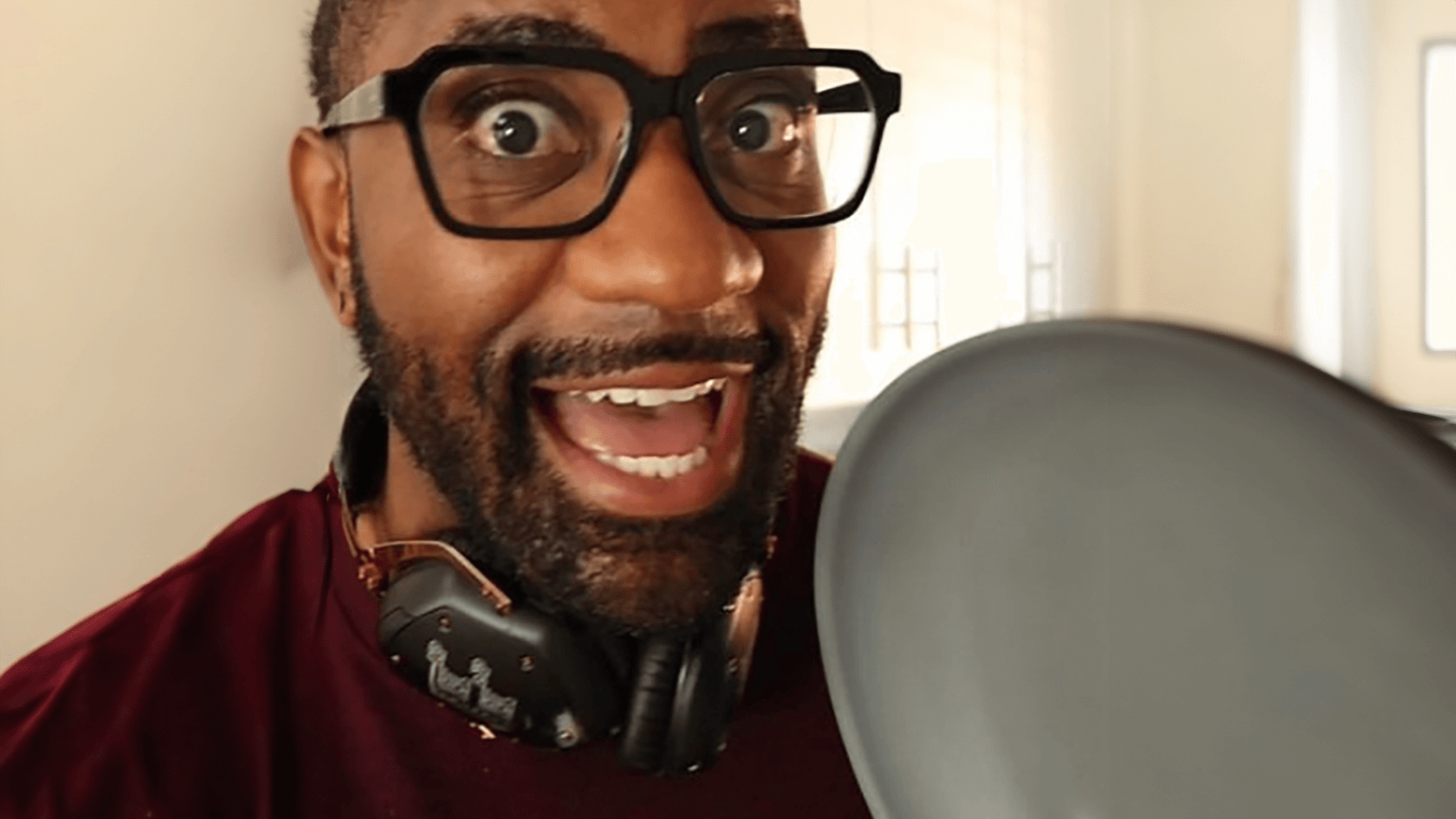 Maynard Okereke holding up a frying pan