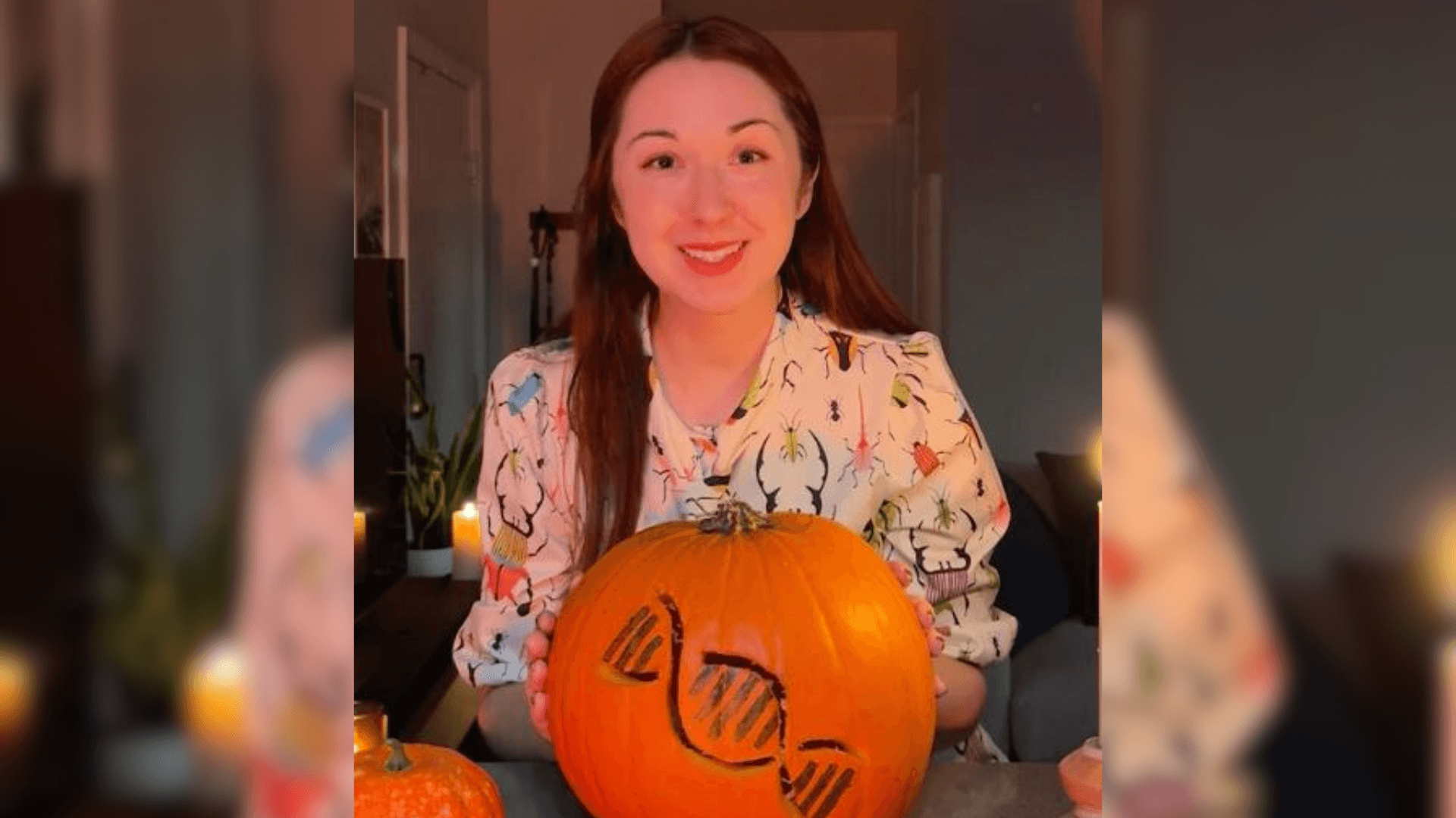 Alex Dainis with a pumpkin carved into a DNA strand
