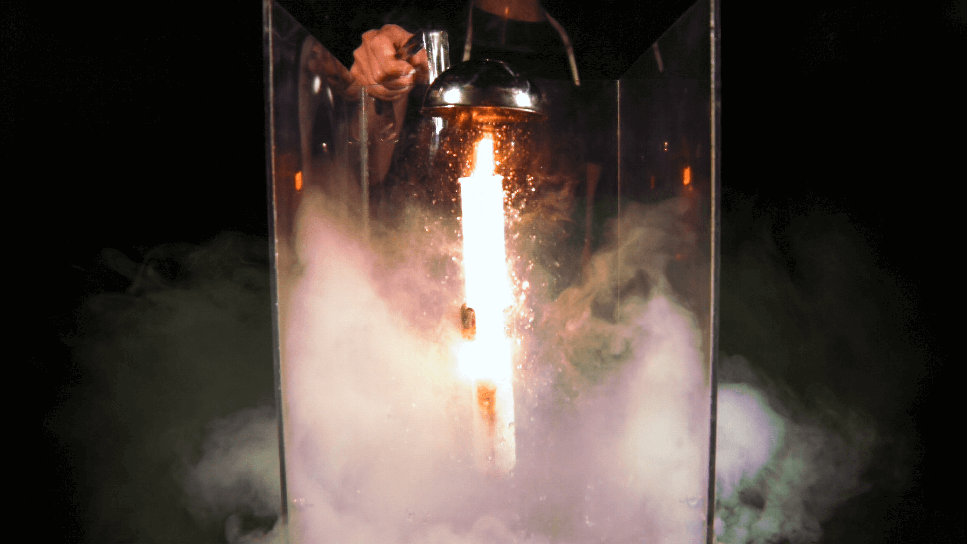 A test tube with bright sparks coming out of it