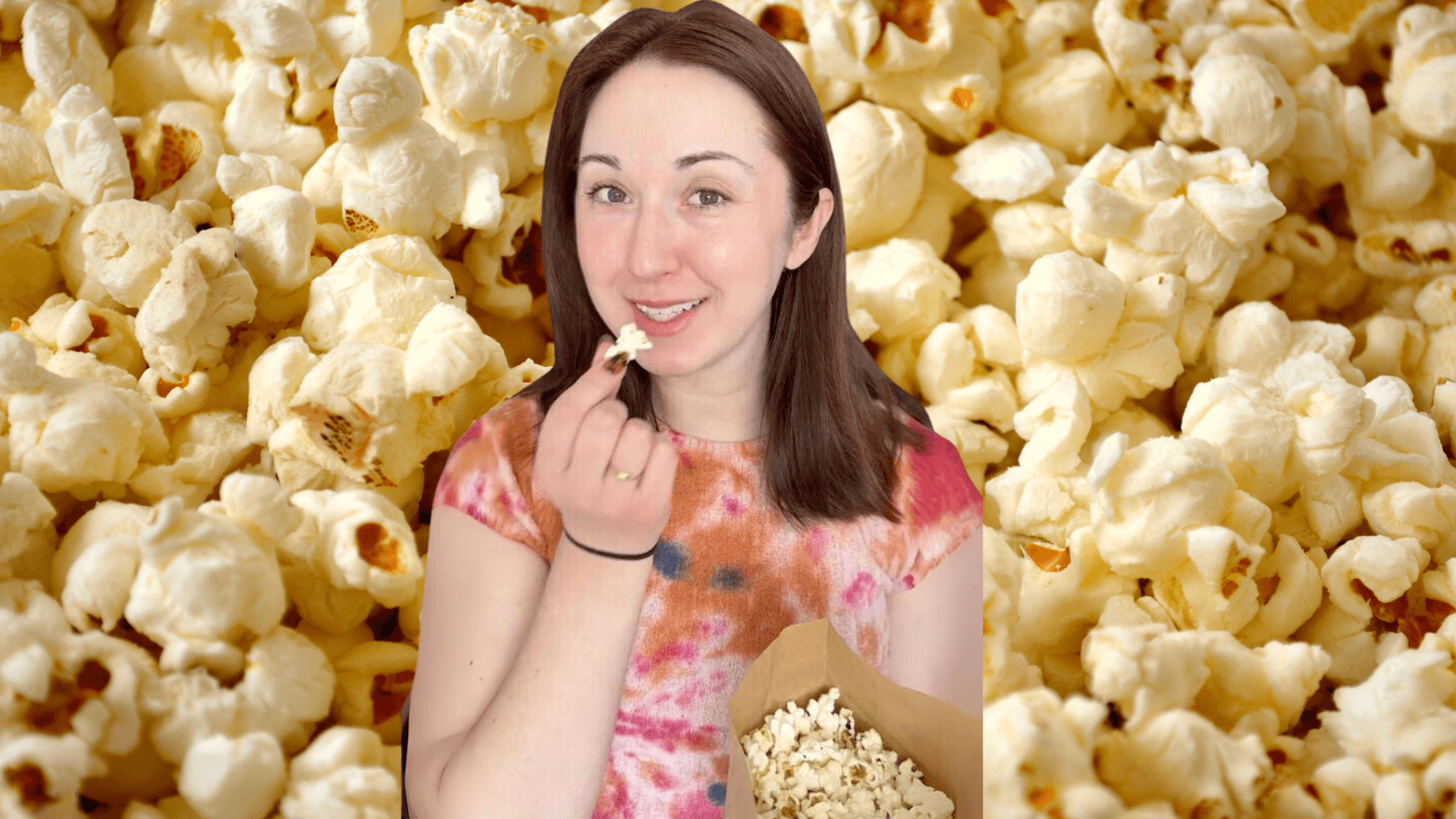 Alex Dainis in front of an image of popcorn
