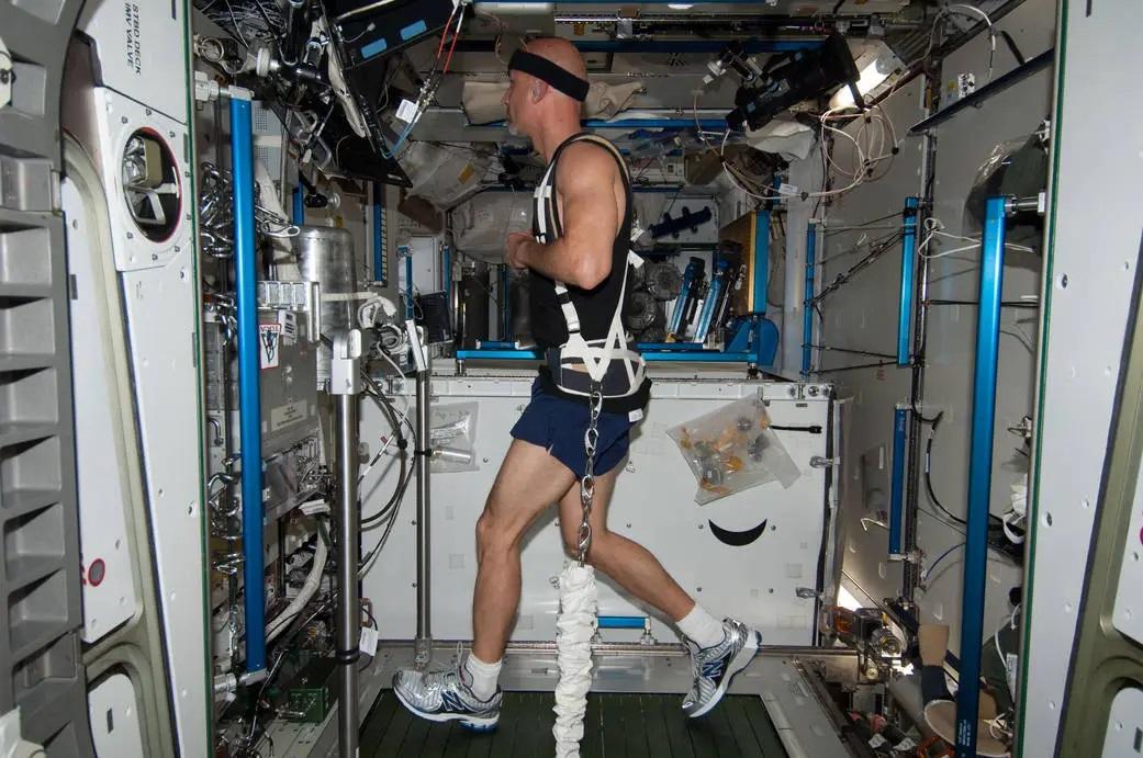 Italian astronaut Luca Parmitano works on out the COLBERT, one of the station’s treadmills.