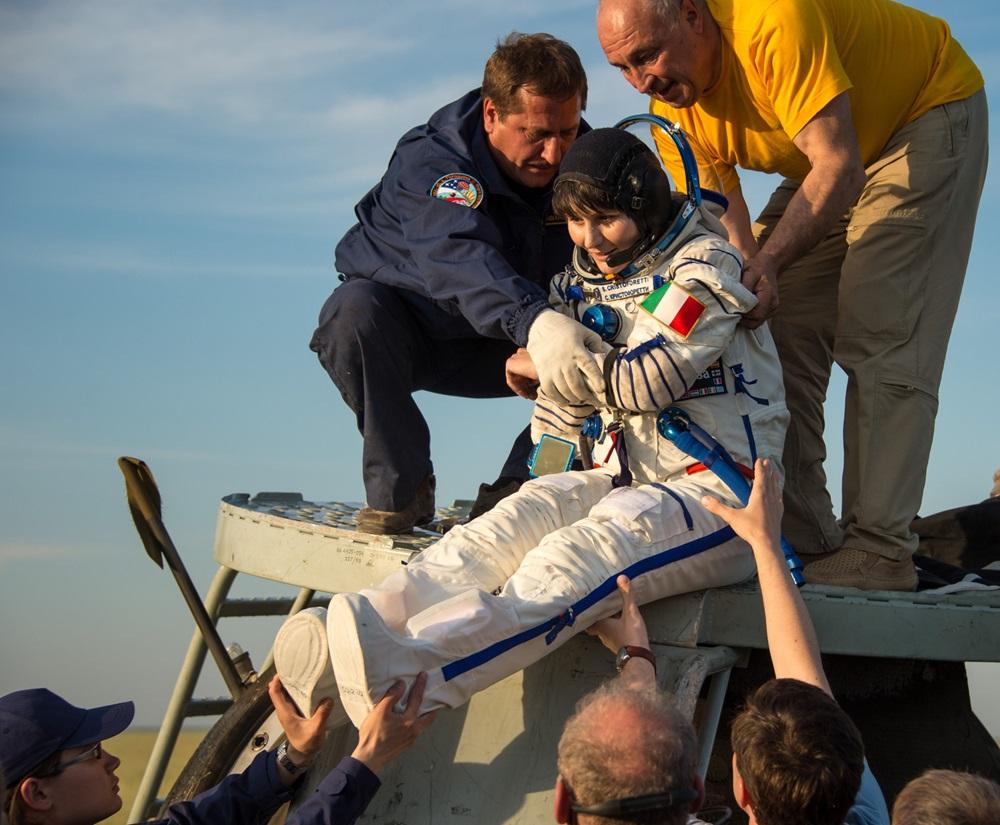 Often when astronauts return to Earth, the affects of spaceflight on their bodies mean they must be helped out of their space capsules. Here Italian astronaut Samantha Cristoforetti is assisted out of her Soyuz capsule.