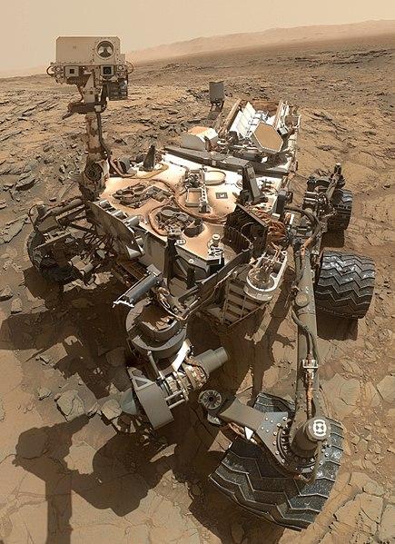 After many years, Curiosity is covered in Martian dust. Credit: NASA
