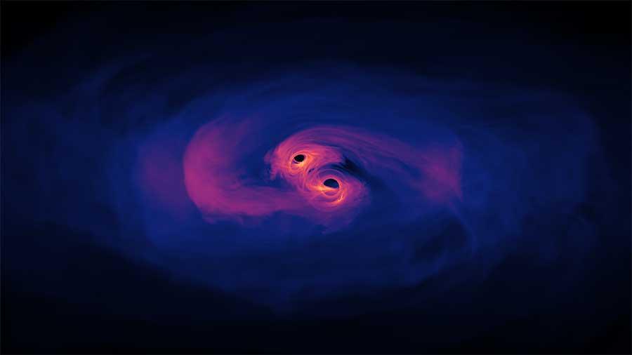 Illustration of two supermassive black holes preparing to merge. Credit: NASA’s Goddard Spaceflight Center/Scott Noble.