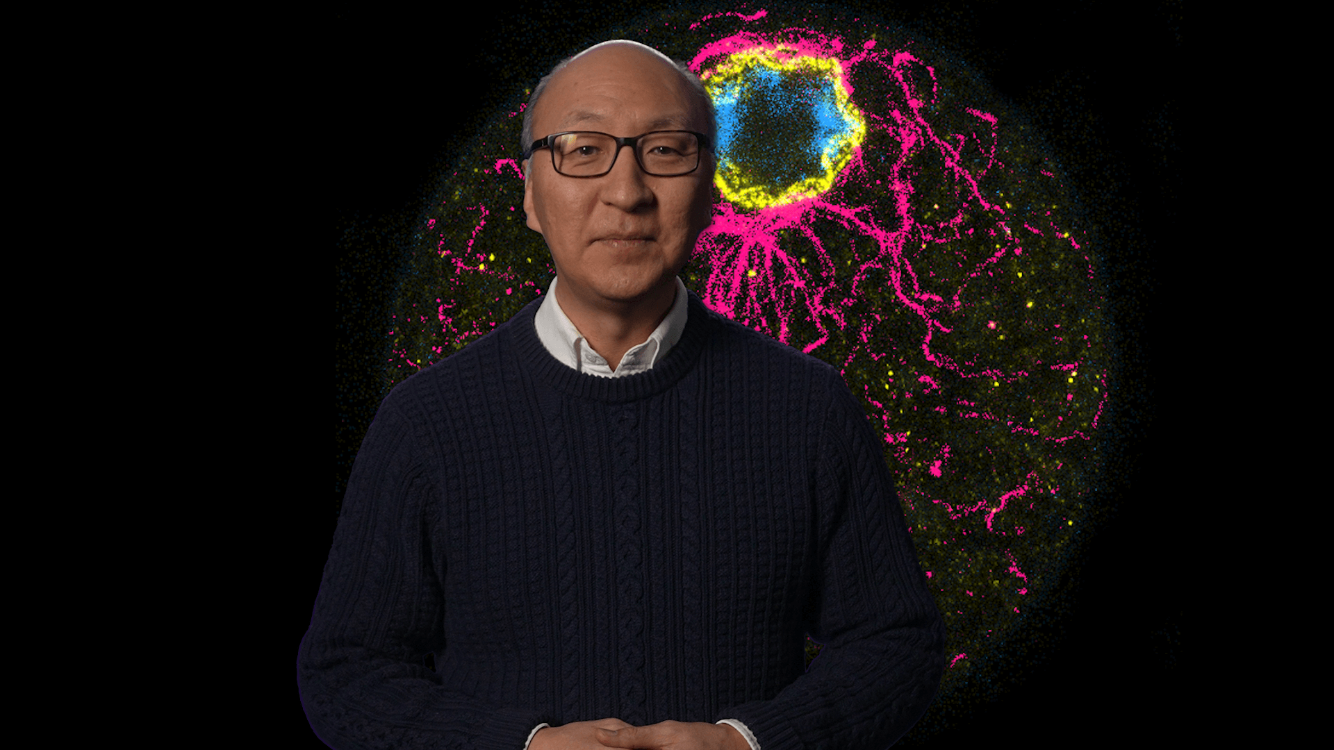 Insoo Hyun in front of an image of C. Perkinsii