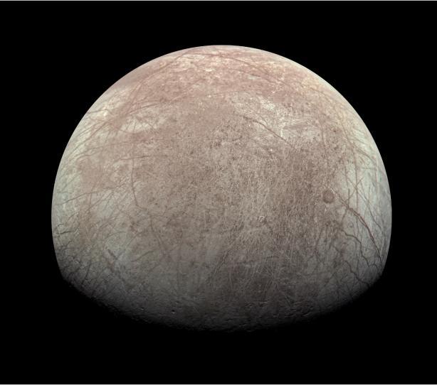 The icy surface of Jupiter’s moon Europa covers a global ocean of liquid water. Credit: NASA/JPL-Caltech/MSSS/Kevin M. Gill