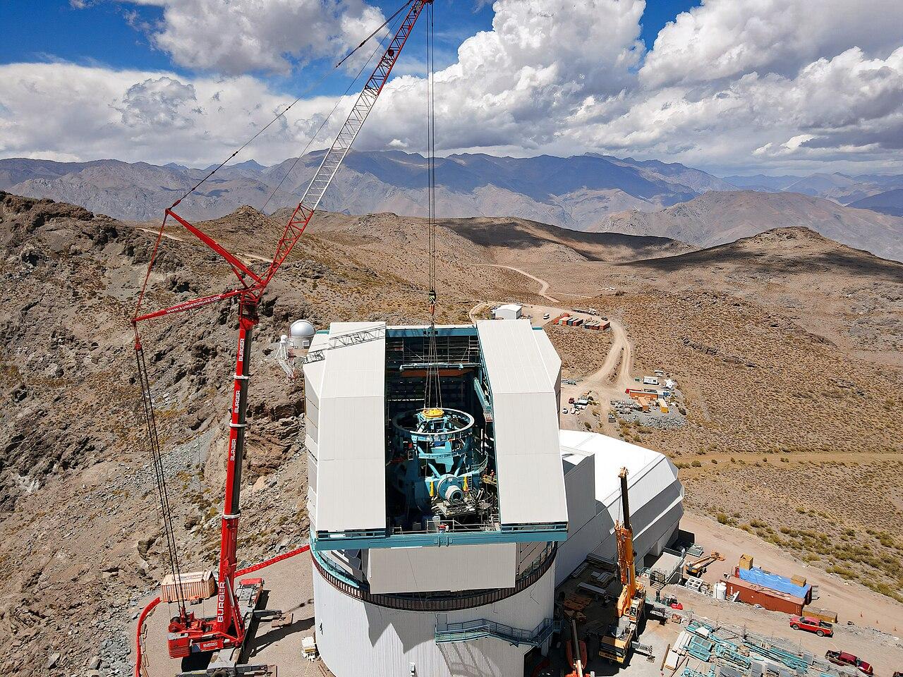 The telescope assembly is lowered into the dome during construction of the Rubin Observatory. Credit: Rubin Observatory/NSF/AURA