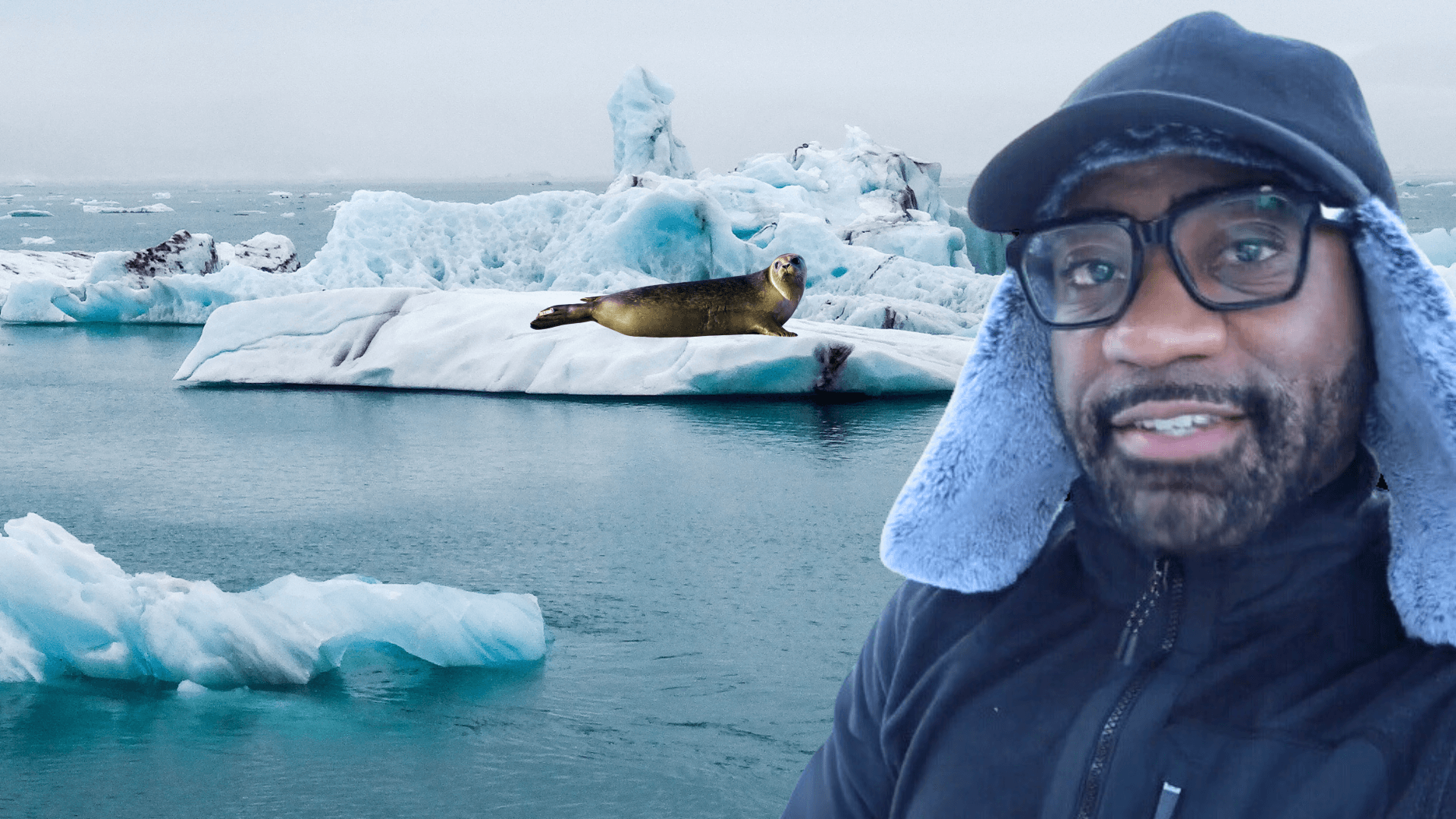 Maynard in a winter hat with ice and seals behind him