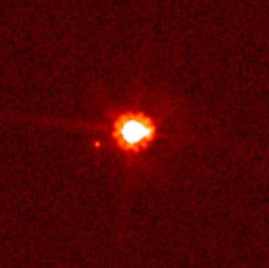 The scattered disk object originally known as Xena, eventually renamed Eris, along with its moon Dysnomia. Credit: NASA/ESA/M. Brown