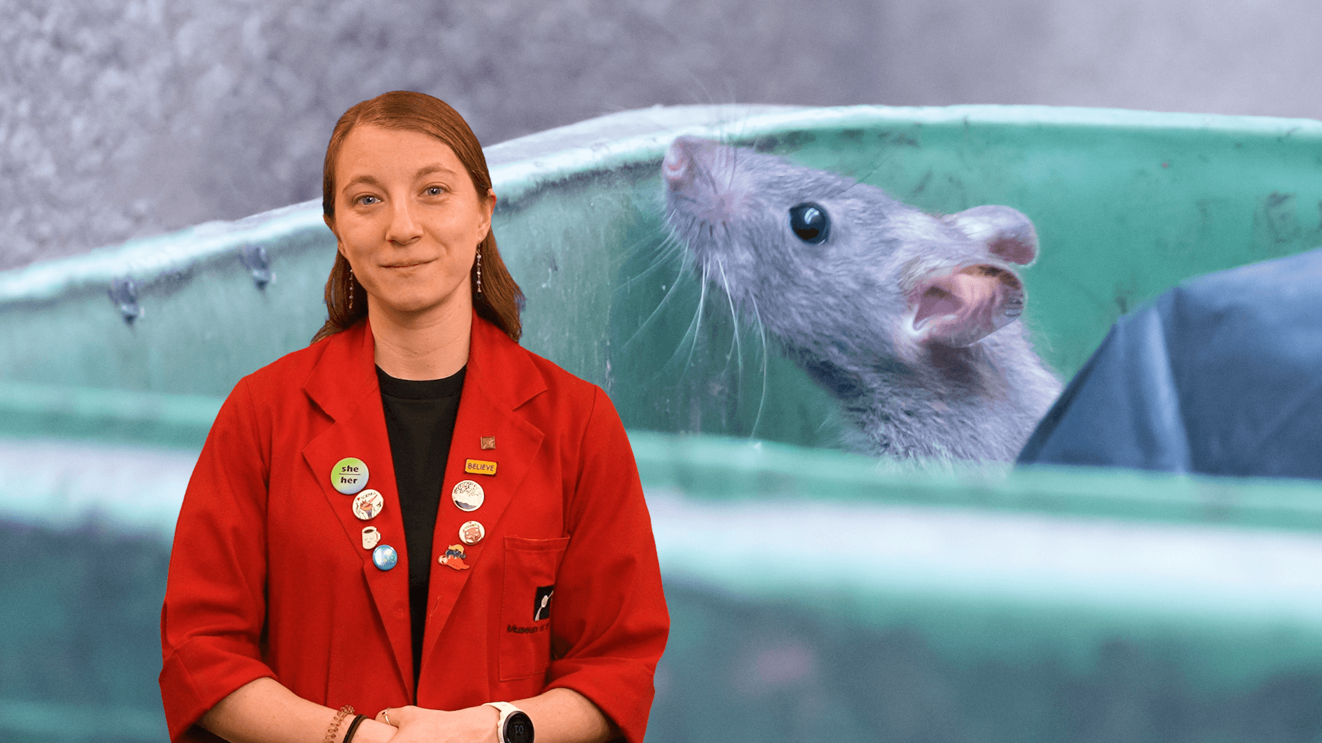Museum Educator Sloane with a picture of a rat