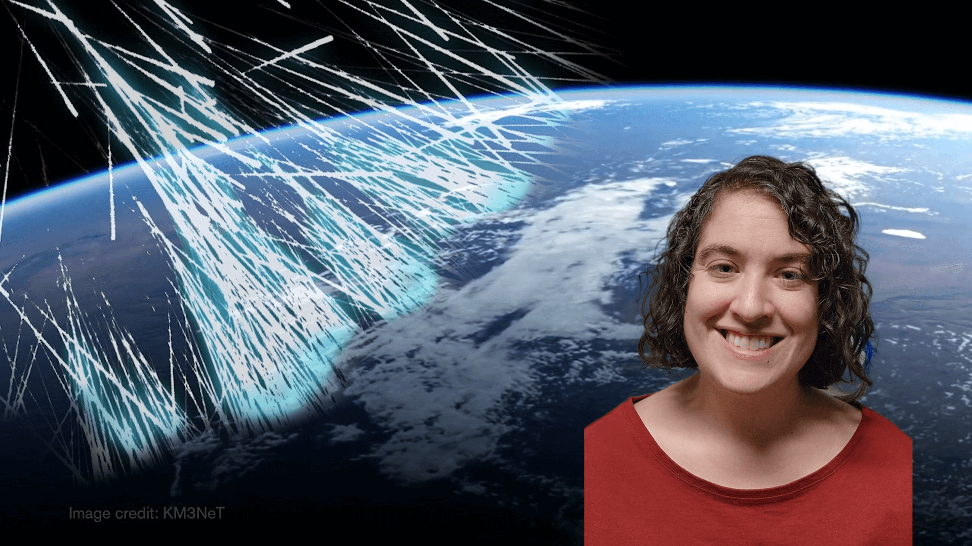 Talia smiling with Earth behind her and particles hitting Earth 